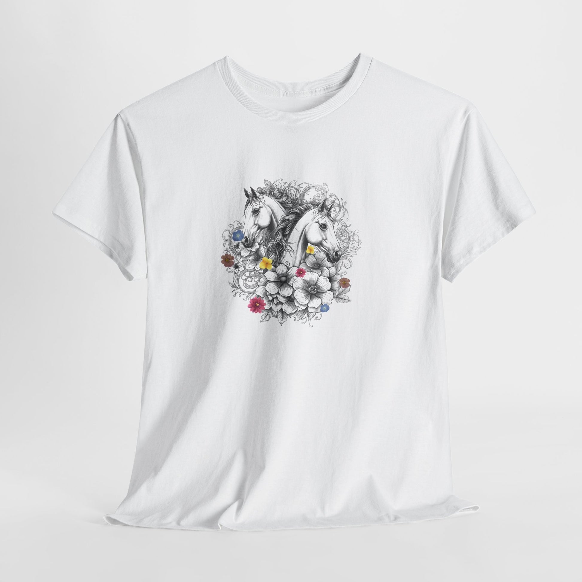 White t-shirt with a decorative unicorn and floral design on a light gray background