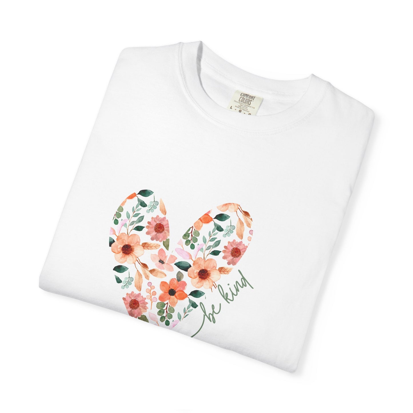 A folded white floral heart be kind graphic tee shirt.