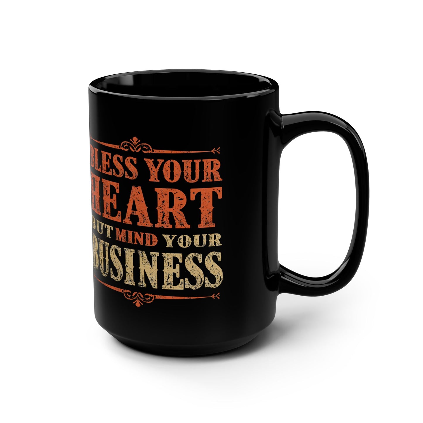 Black mug with orange and beige text on a white background
