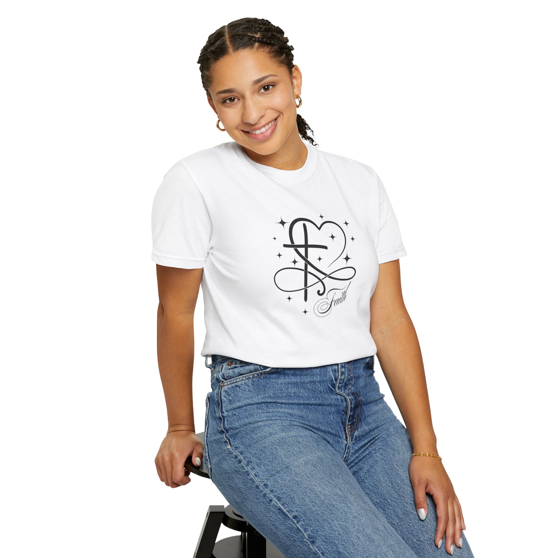 Girl sitting on stool wearing a heart cross and stars faith graphic tee shirt.