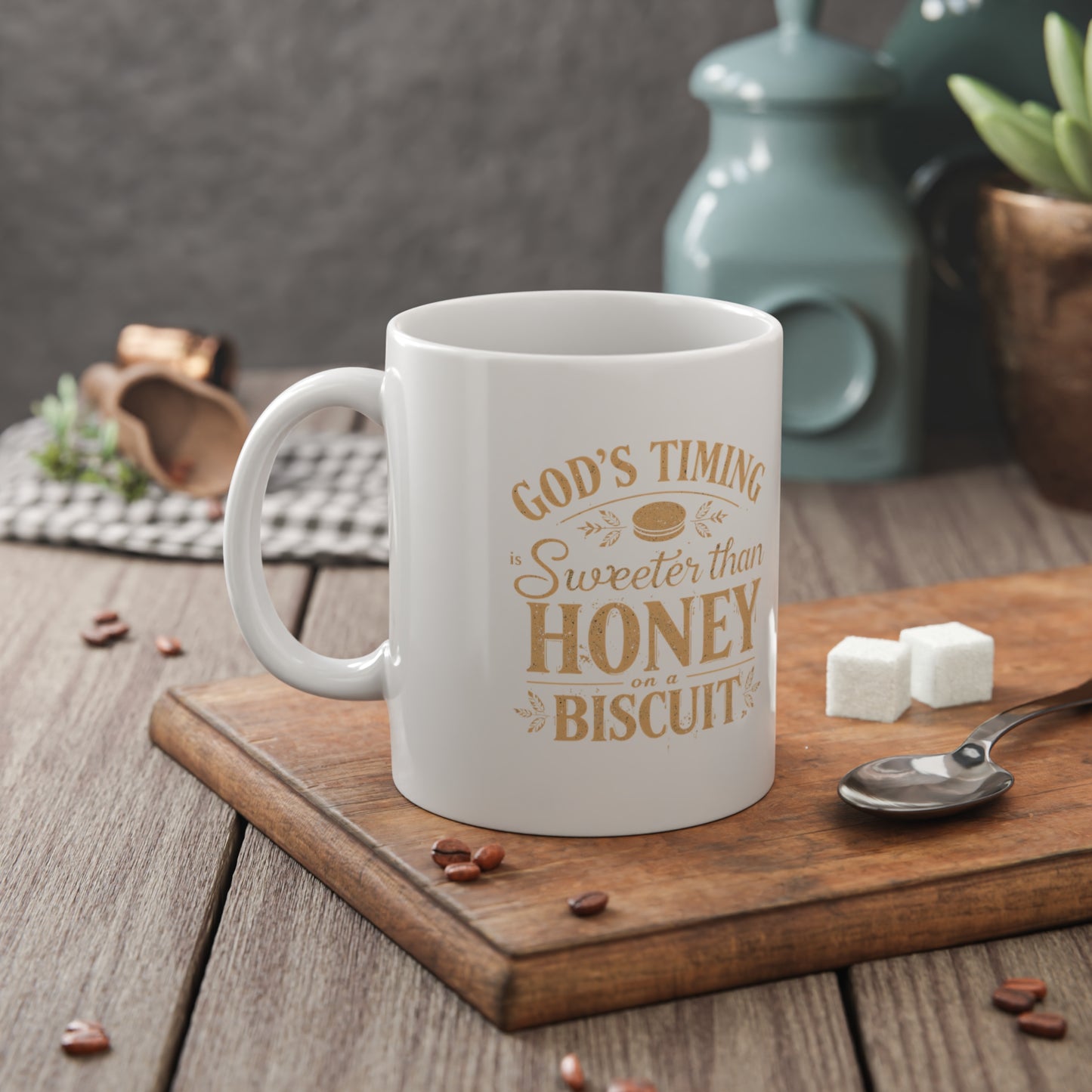 White mug with text on a wooden cutting board with coffee beans and sugar cubes.