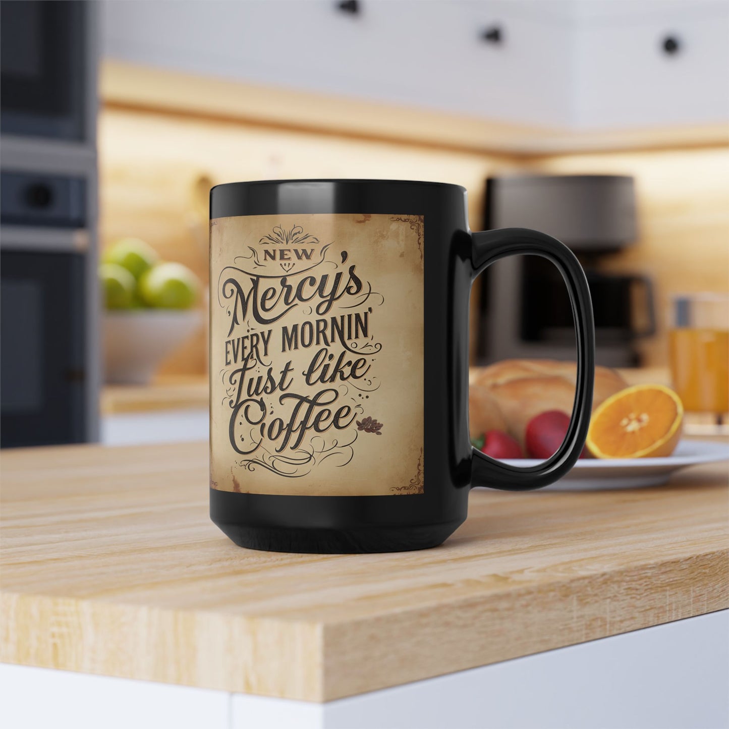 Black mug with a decorative text design on a kitchen counter
