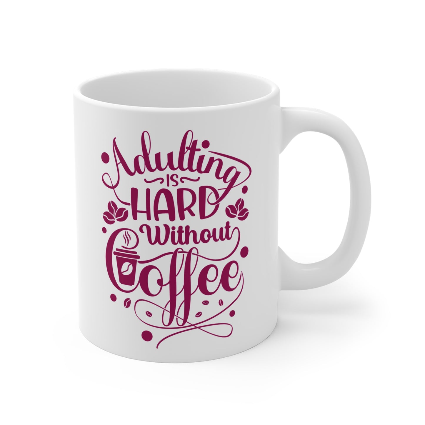 White mug with pink text 'Adulting is Hard Without Coffee' on a white background