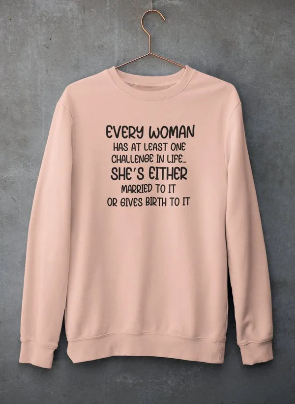Beige sweatshirt with humorous text on a gray background