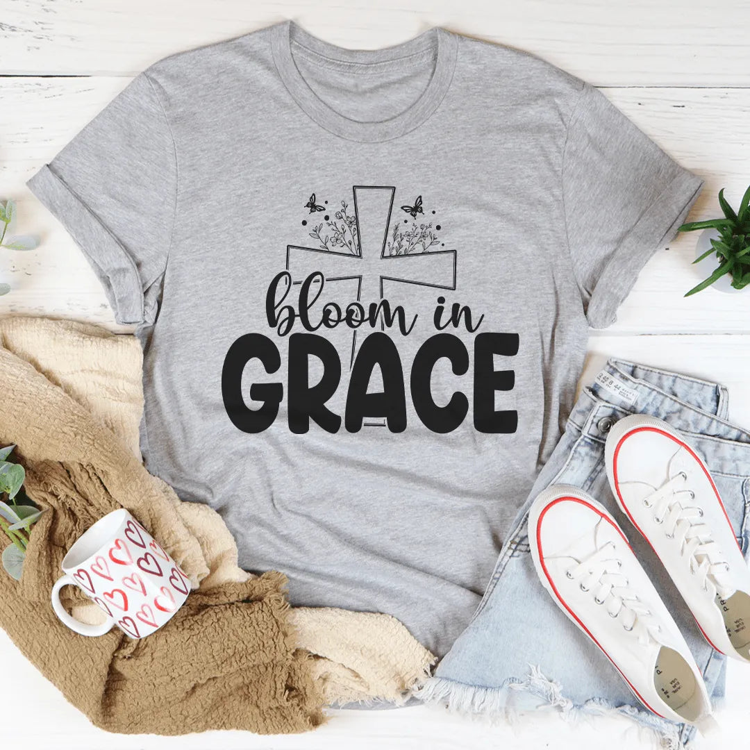 gray t-shirt with shoes and cup with blanket and jean on white wood background