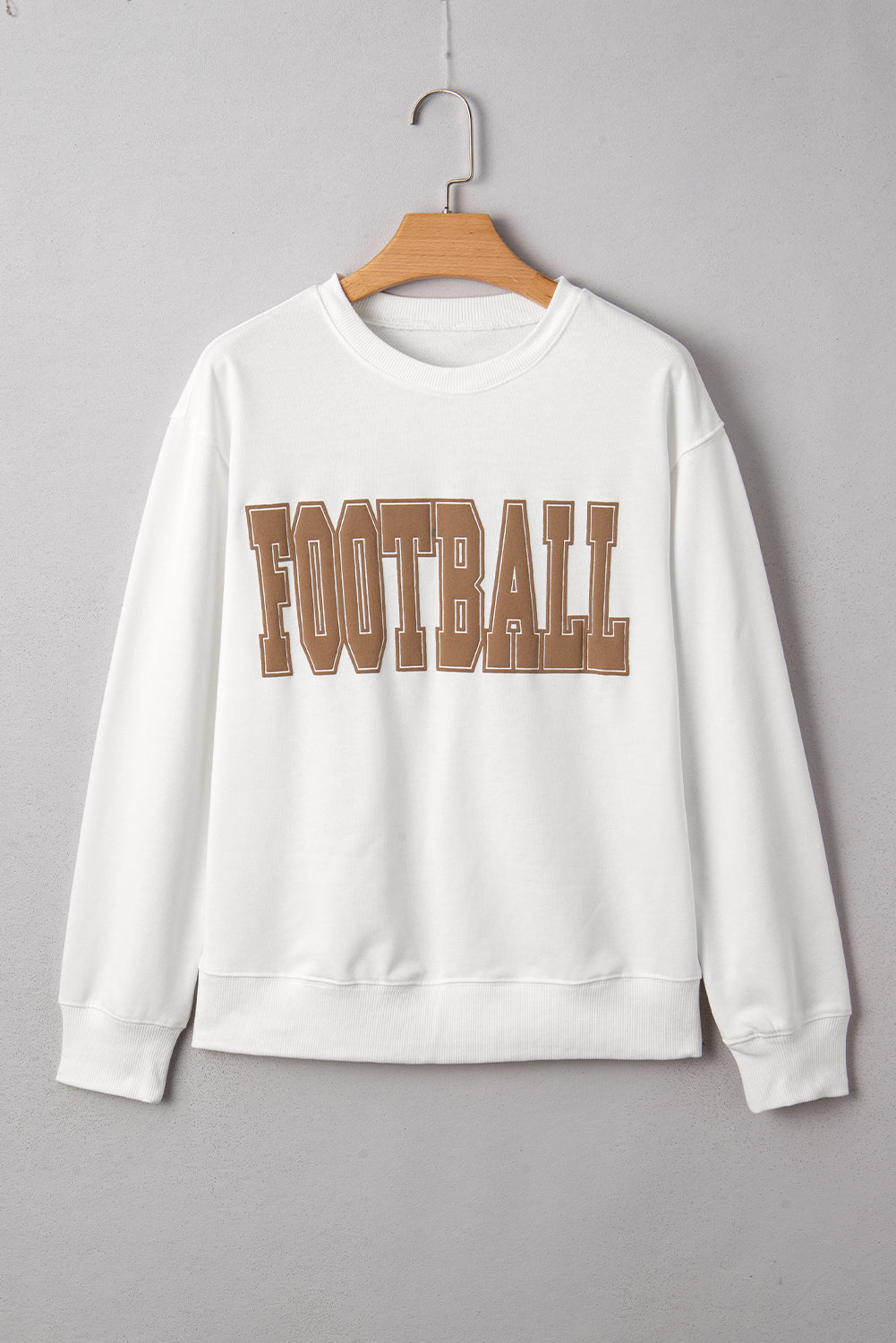 White sweatshirt with 'FOOTBALL' text on a gray background