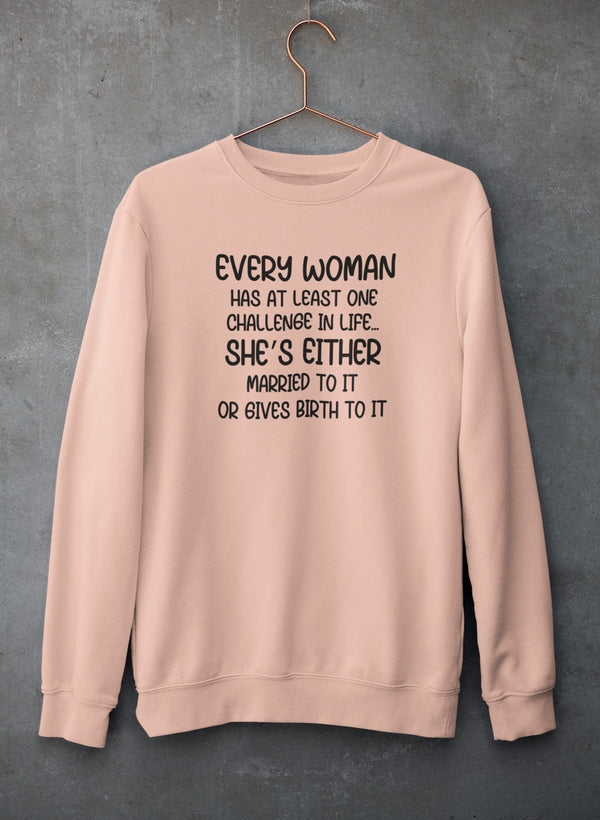 Pink sweatshirt with humorous text on a gray background
