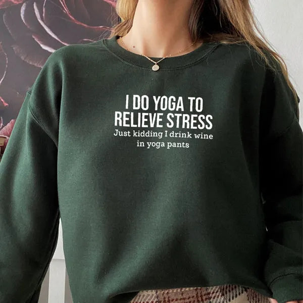 Person wearing a green sweatshirt with humorous text design.