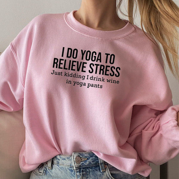 Person wearing a pink sweatshirt with humorous text design.