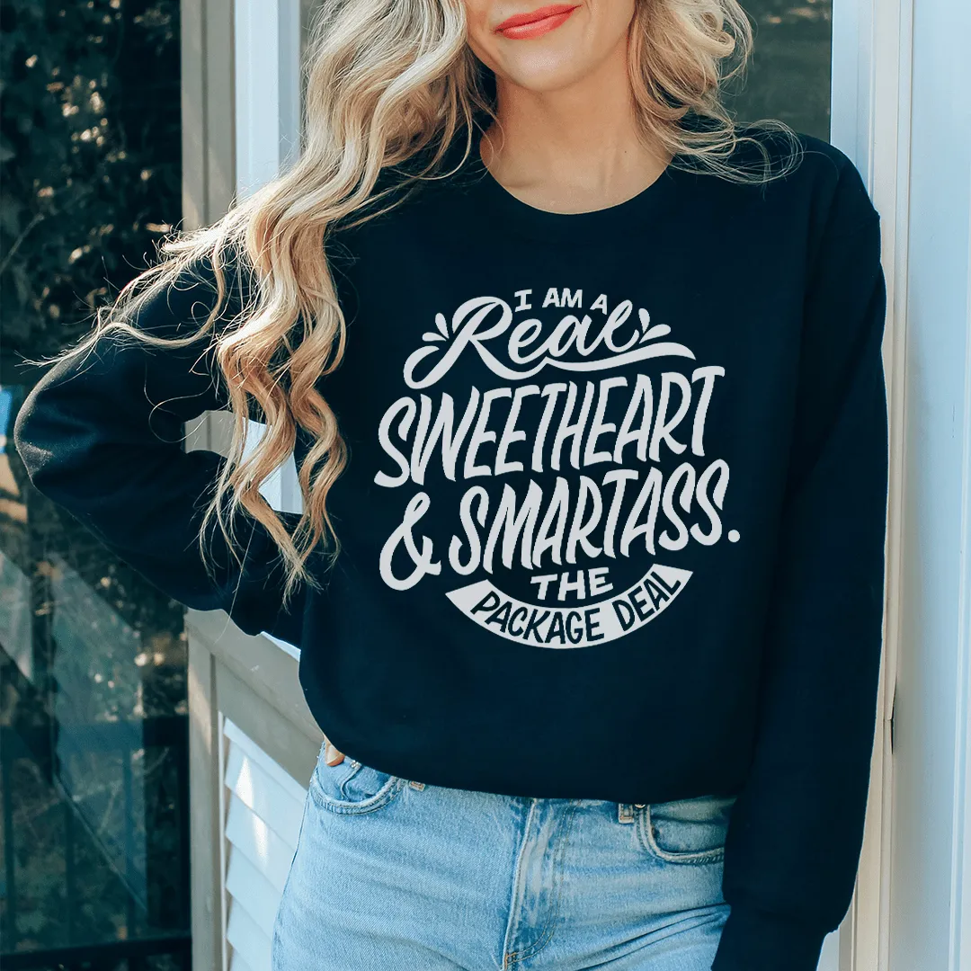 Person wearing a black sweatshirt with white text standing outdoors.