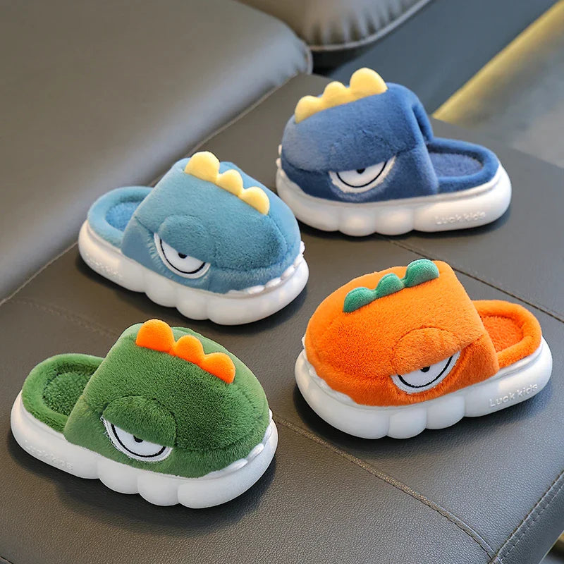 Four colorful slippers with cartoonish designs on a gray surface.