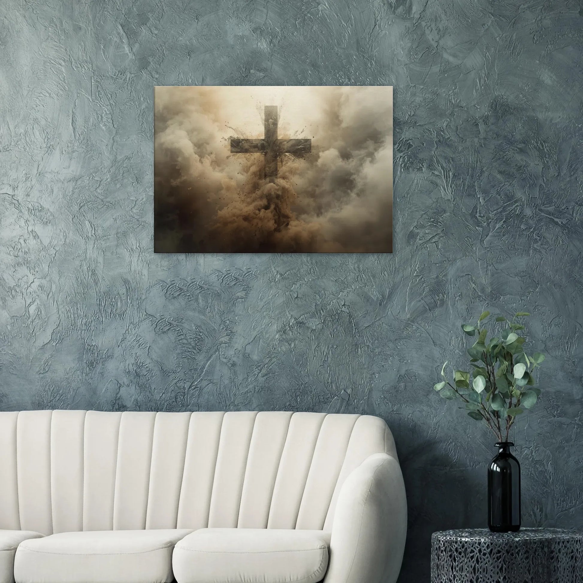 Cross artwork on a textured wall above a sofa with a plant on a side table.
