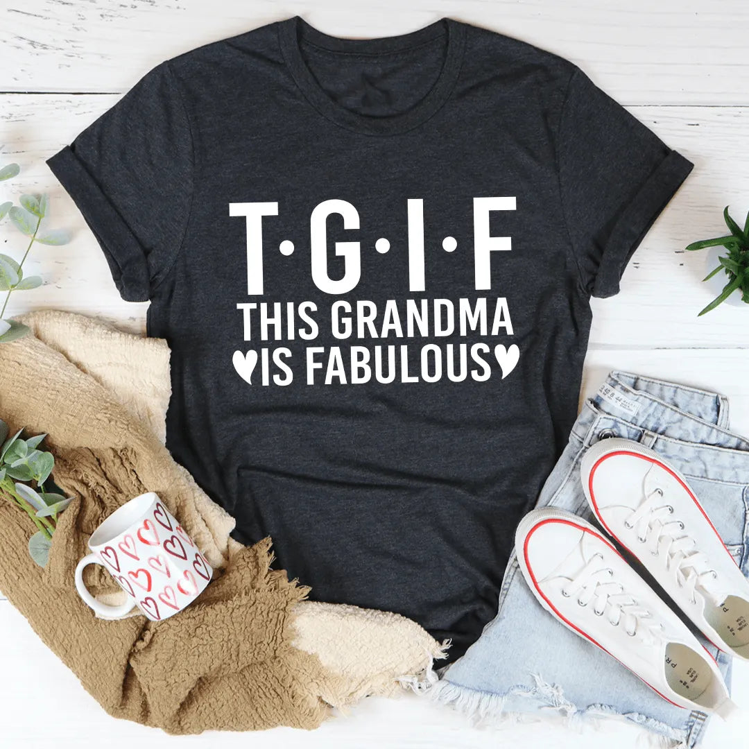 Black t-shirt with 'T.G.I.F. This Grandma is Fabulous' text on a wooden surface with casual items.
