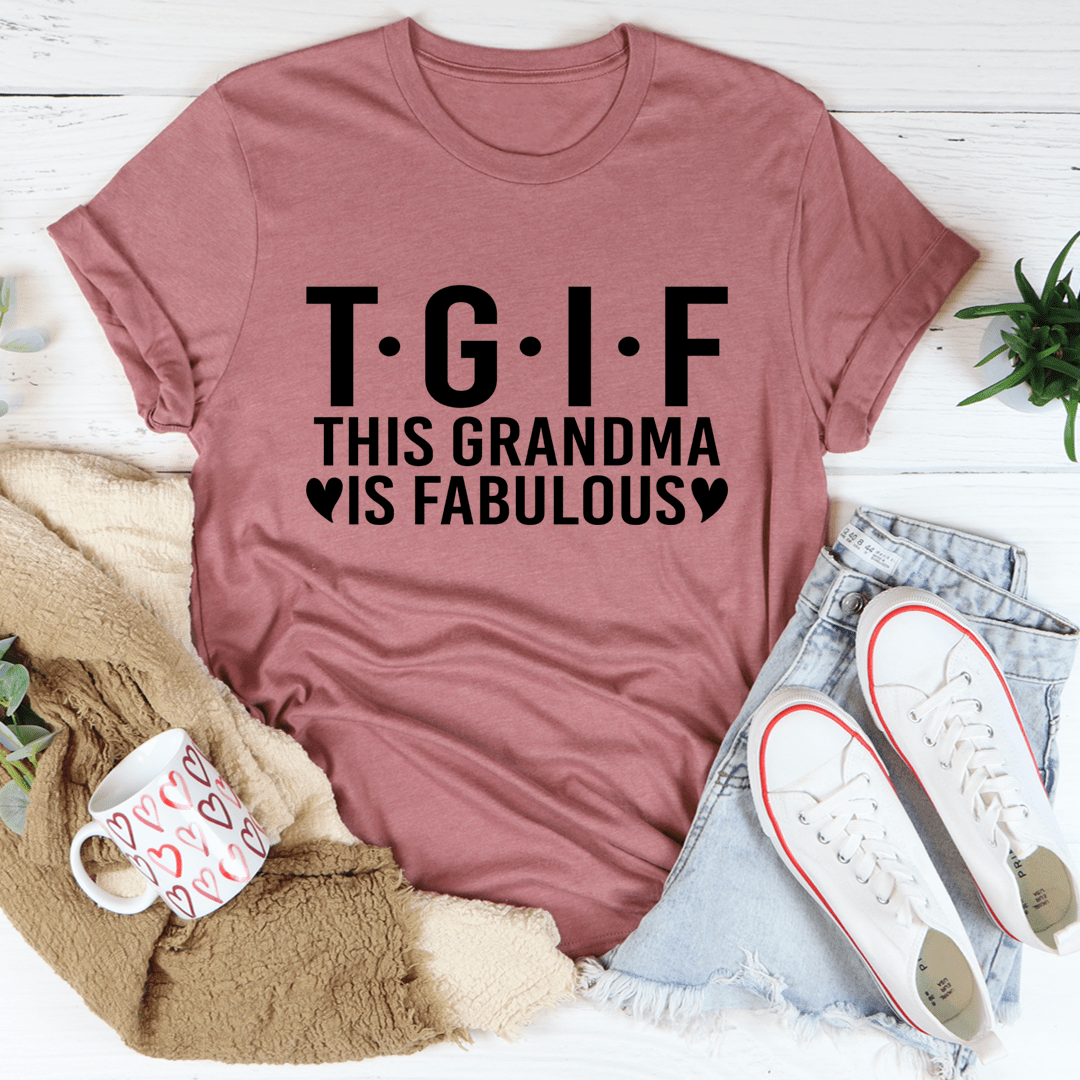 Mauve t-shirt with 'T.G.I.F. This Grandma is Fabulous' text on a white surface with casual items.