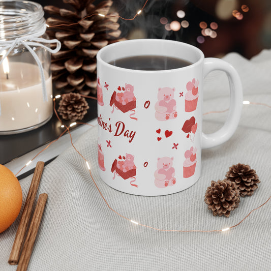 White mug with Valentine's Day design on a table with decorative items